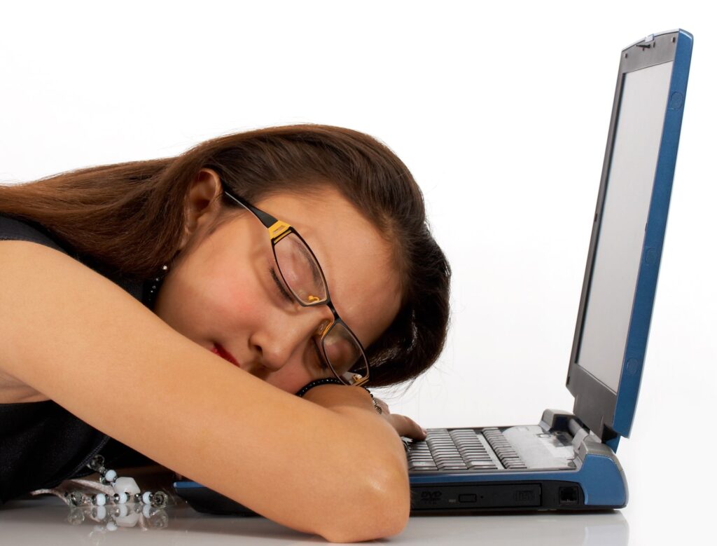 Girl asleep at her computer